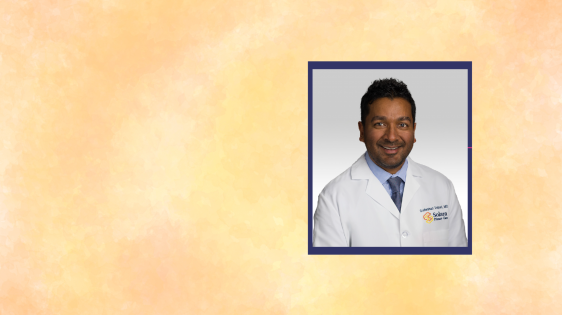 picture of Dr. Velpari with an orange yellow watercolor background